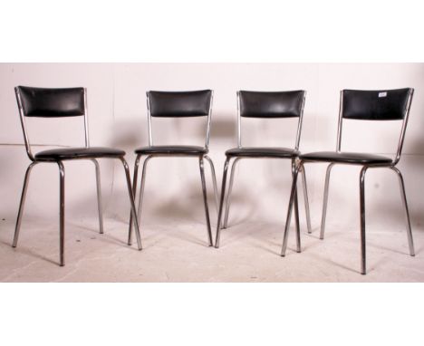 A set of four retro / vintage chrome framed stacking chairs, each having a black vinyl seat pads and matching back rests all 