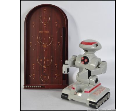 A collectable remote control R.A.D robot, a Star Wars comm talk and a Past Times bagatelle board. Measures: robot 50cm H