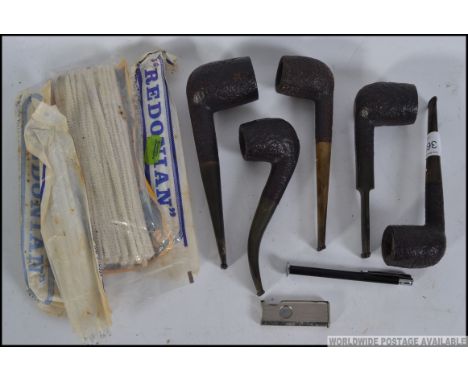 A collection of five Dunhill White spot Shell Briar pipes, to include three straight and two others, with a quantity of pipe 