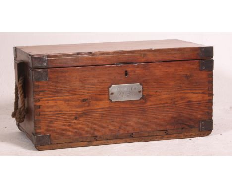 A vintage early 20th century industrial pine chest, having rope handles with an applied brass plaque to the top. 69cm x 35cm 