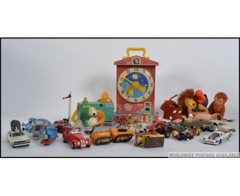 A collection of vintage toys to include Fisher Price Teaching Clock, Pocket Camera, die cast toy cars etc