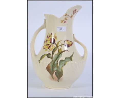 A Victorian ceramic double handled water pitcher / jug of large form by George Jones & Sons in the Tulip pattern. Measures: 5