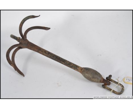 An early 20th century grappling hook of cast iron having 6 prongs with clasp to one end - ideal as meat hook  / light convers