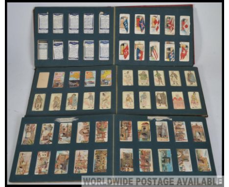 A collection of 3 Wills cigarette card albums being filled in the main. To include Signalling Series, Naval Dress & Badges, O