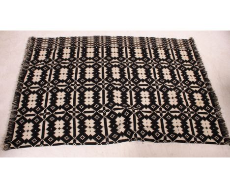 A vintage mid 20th century Welsh marriage blanket Traditional Welsh geometric blanket on a black ground. Measures: 237cm x 16