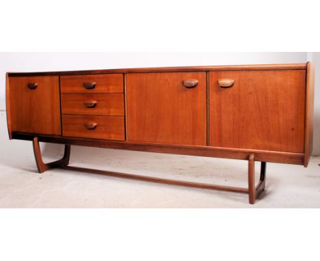 Retro / vintage Danish style teak sideboard circa 1960's, having a run of three drawers flanked by a pair of inset sliding do