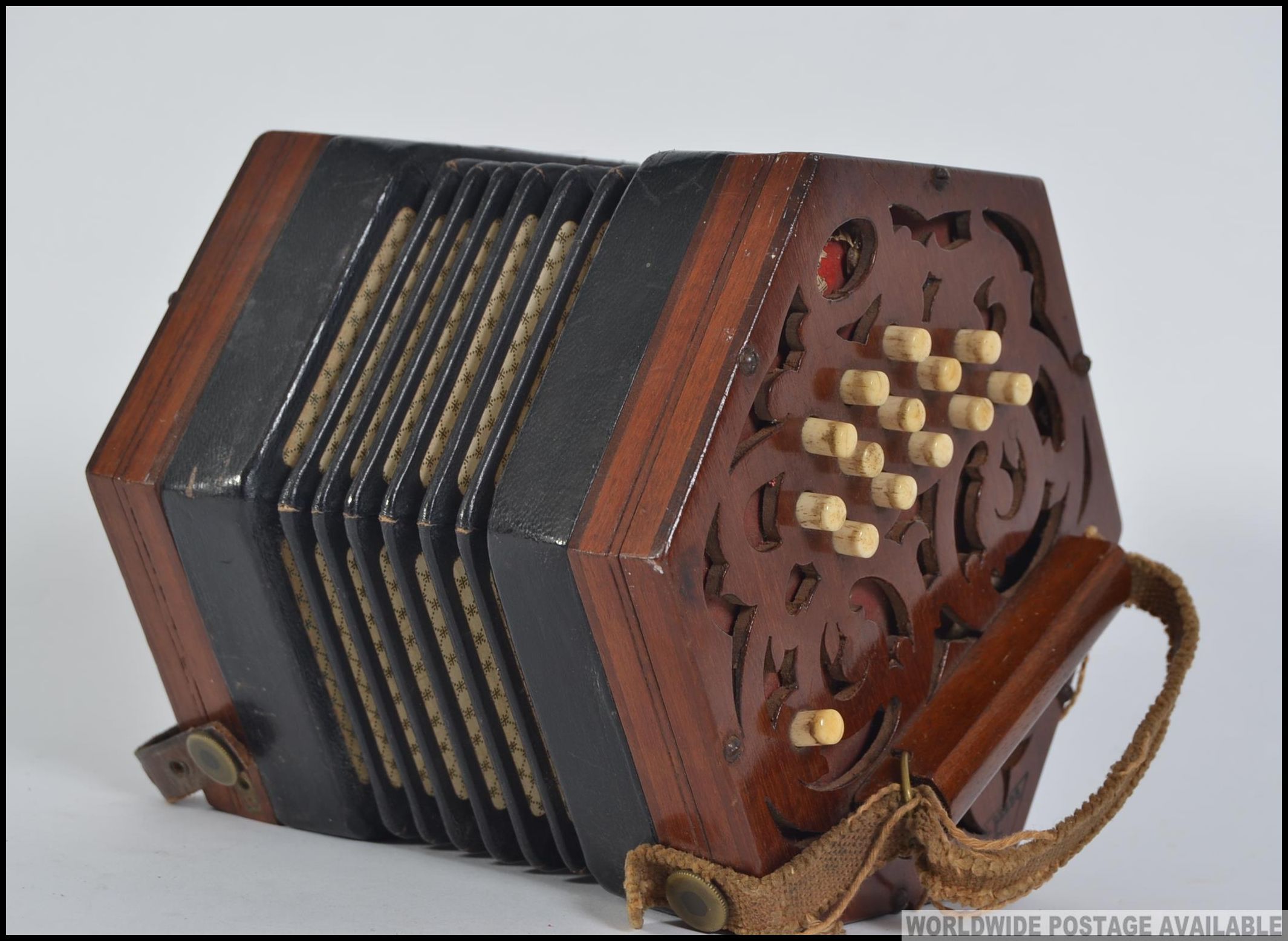 A Victorian mahogany squeeze box musical instrument. The box with ...