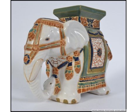 A 20th century large Chinese ceramic planter / stool in the form of an Elephant. Measures: 27cm H.