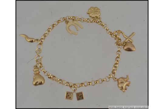 An Italian 9ct Gold Charm Bracelet With Horn Of Plenty Dice Horse Previous
