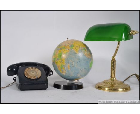 A collection of retro items to include a bankers lamp, a retro ring dial telephone along with a small globe. Measures: 32cm H