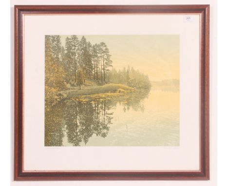  A signed lithograph print by Kenneth Leech entitled Fir Island. The print depicting lake and forest scene being framed and g