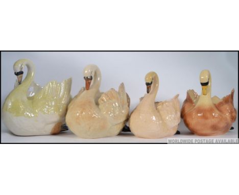 A collection of 4 large ceramic swan planters. One marked to underside with Model No, possibly Beswick. Measures: 18cm H.