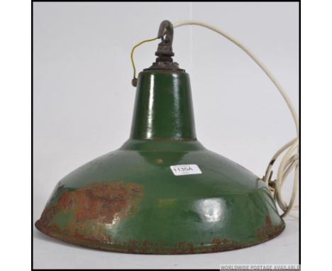 A vintage mid century Industrial enamel painted factory light shade. Complete with bracket top, green and white painted. Meas