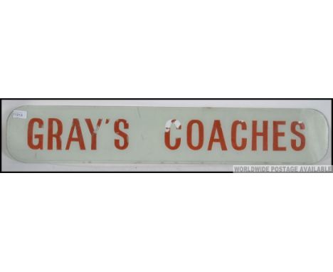 A large rare vintage retro Grey's Coaches glass advertising sign in original condition .  The glas with grey background with 