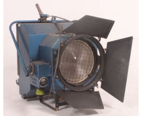 A large retro theatre lamp, by Berkey Colortran, complete with barn doors having the original paintwork etc / makers plaque t