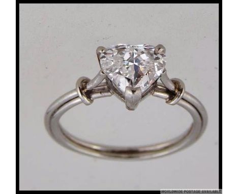 An 18ct white gold ring with large prong set heart cut moissanite. Size K.5. Weight 3.5g.
