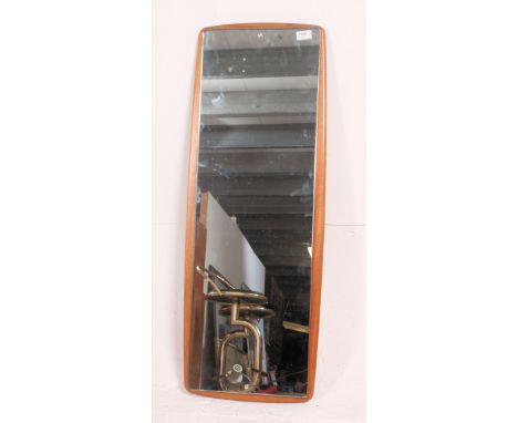 A large 1970's retro frameless teak wall mirror of atomic form. The frameless mirror with teak wood back. Measures: 100cm x 7
