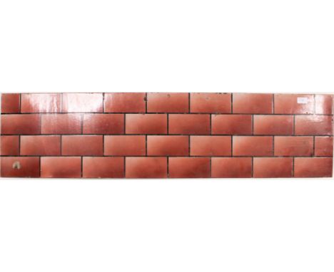 A vintage enamel metal advertising sign with brickwork design, the metal of rectangular form. Measures: 122cm x 30cm.