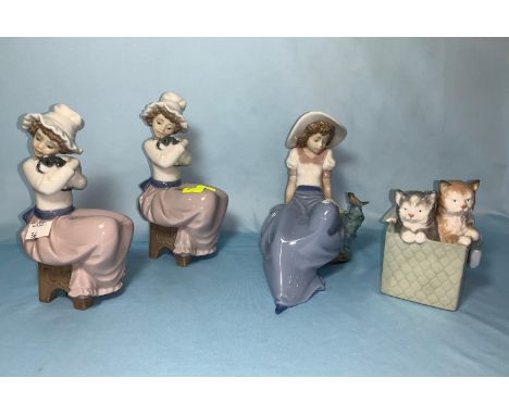 4 Nao figures - 2 girls with puppies, girl with bird cats in box 