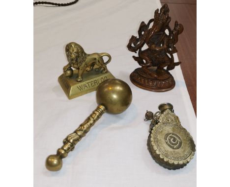 A middle eastern metal flask, a copper/brass figure of Ganesh, a Waterloo lion and another item 