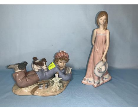 A Lladro group reclining boy &amp; dog L18cm; a Lladro figure of girl holding sun hat Ht 20cm 