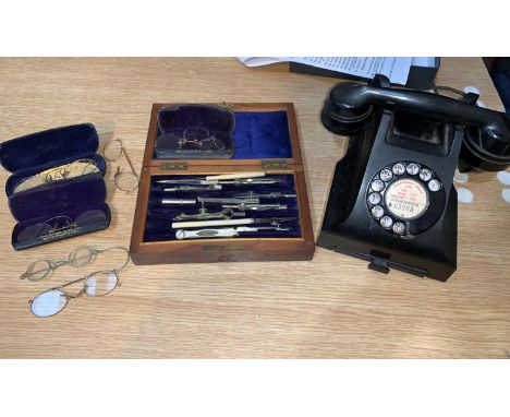 A rosewood cased set of drawing instruments, various spectacular, a vintage telephone 