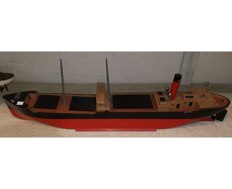 A scratch built motor launch with live steam engine Westland in red and black 
