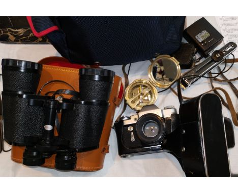 A Zenit camera, a pair of Super Zenith binoculars and a prismatic compass 