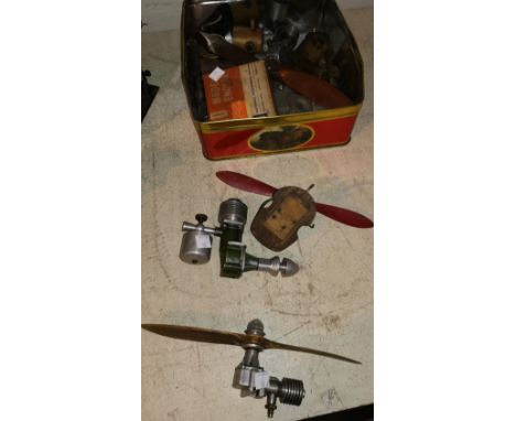 4 model aircraft engines with various propellers etc 