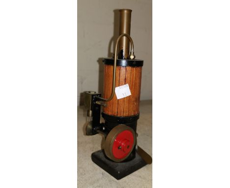 A small vertical spirit driven steam engine 