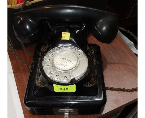 A vintage Japanned metal wall mounting Bells Rotary telephone 