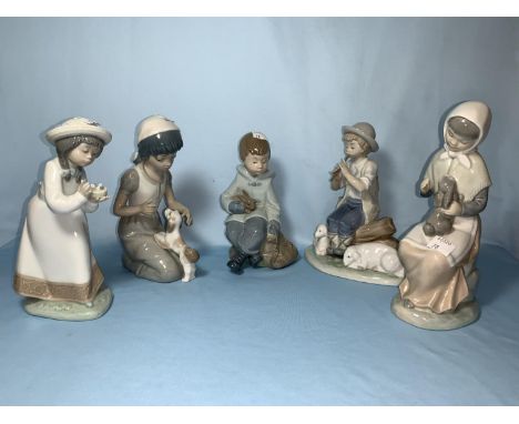 4 Nao figures of children and 1 similar 