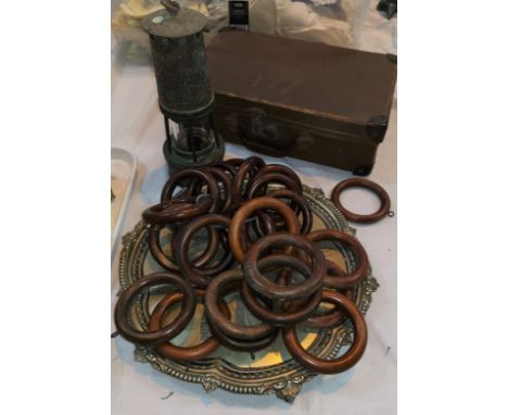 A Miner's safety lamp; a brass oil lamp with shade; a brass handbell; Victorian wooden curtain rings; a desk blotter and silv