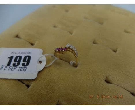 An 18ct ruby and diamond crossover ring 3 grams, size N