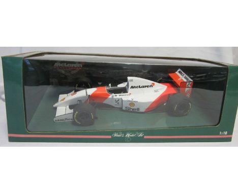 F1 MODEL CARS - AYRTON SENNA        Issued by Paul's Model Art, Minichamps, a 1:18 scale F1 McLaren Ford MP4-8 1993 includes 