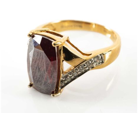 18CT AMAYANI CUPRITE & DIAMOND RING, principle emerald cut stone 13 x 8.5mm, the shoulders set with 10 round brilliant cut di