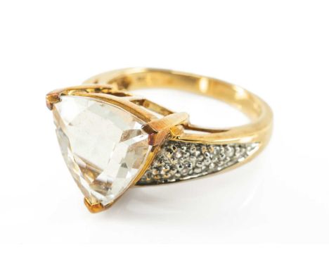 9CT QUARTZ RING, the trilliant cut stone 12mm (diam.), with multiple, presumed, white sapphire accented shoulders, 5.3gProven