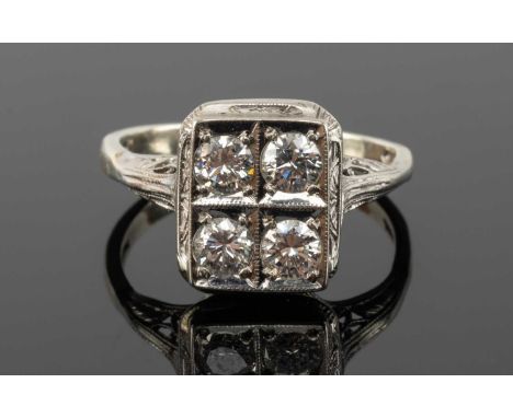 9CT WHITE GOLD FOUR STONE DIAMOND RING, the four round cut stones measuring 0.15cts approx. each, ring size P 1/2, 3.4gmsProv