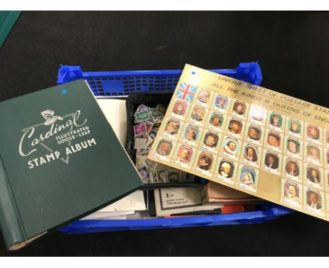 A box of stamps and stamp related material.