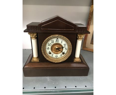 A late 19th century metal cased architectural mantle clock.