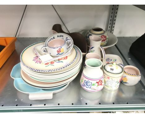 A quantity of various white bodied Poole Pottery items.