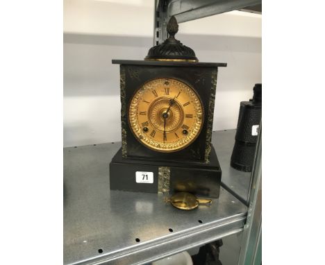 A late 19th century small slate cased mantle clock with acorn finial (33cm).