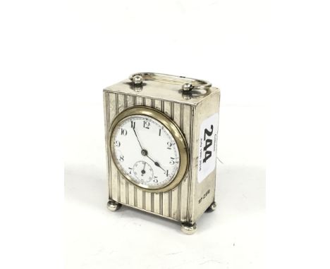 A small silver cased carriage clock style watch holder (watch loose).
(R7)