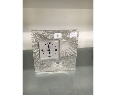 A Daum glass cased mantle clock with ice glass design frame.