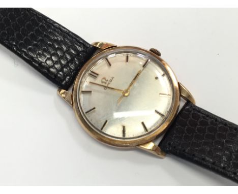 A gentleman's 9ct gold Omega Manual winding wrist watch with champagne coloured dial and gold numerical batons Condition Repo