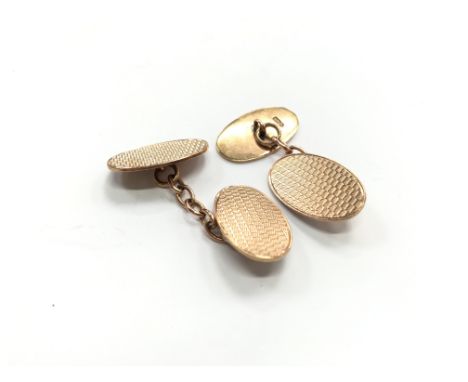 A pair of 9 carat rose gold engine turned cuff-links, hallmarked 1925 (total weight 7.7 grams).