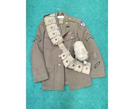 A U. S. Army canvas belt and water bottle together with a small U. S. Air Force jacket with brass and woven badges.