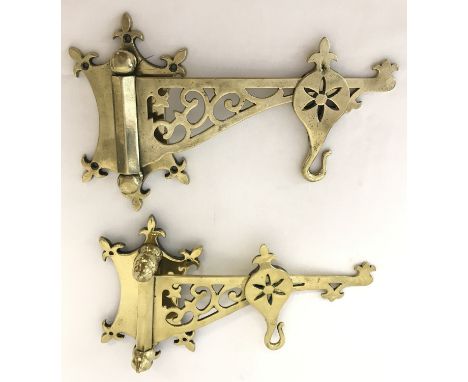 A pair of Victorian brass wall mountable lamp hooks. With folding decorative arms and sliding hooks. Wall bracket approx. 20c