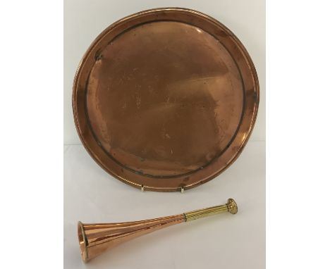 A small vintage copper and brass hunting horn together with a circular copper tray. Horn approx. 24.5cm long, tray approx. 30