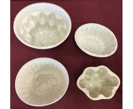 4 antique ceramic jelly/blancmange moulds, of varying sizes.